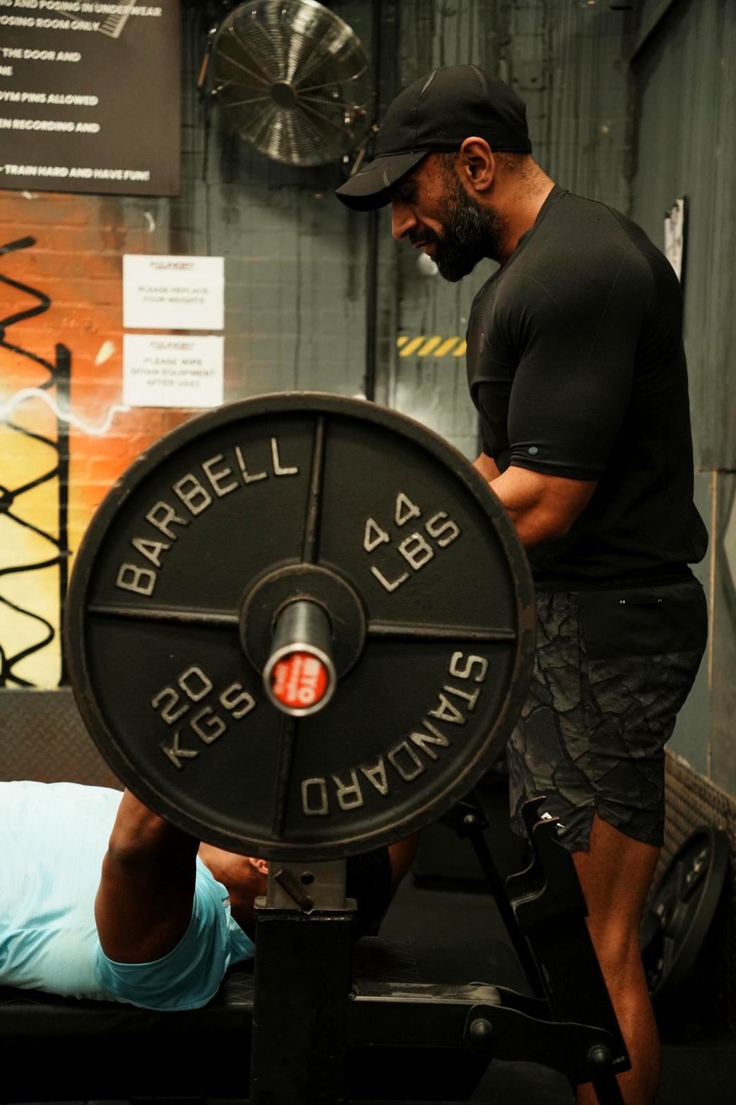HSK Coaching spotting a client bench press